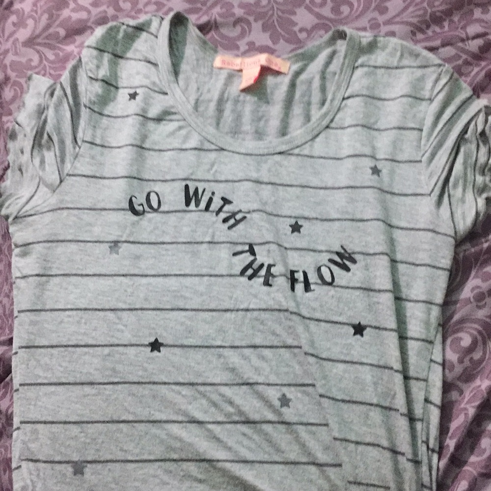 A gray shirt that says go with the flow 👍🏻